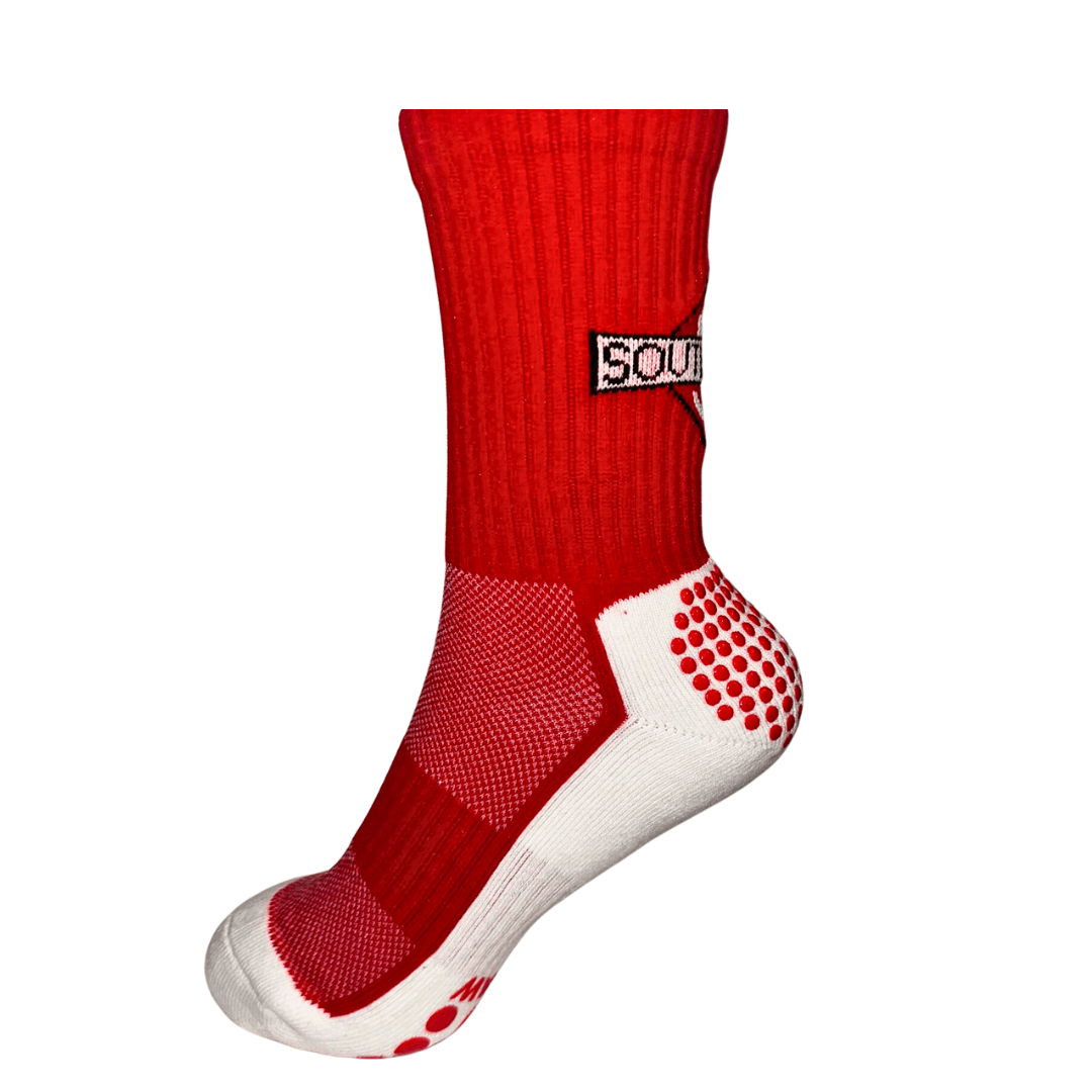 side view of The worlds Best boxing socks by Southpaw official. White bottom with red branding and grips.