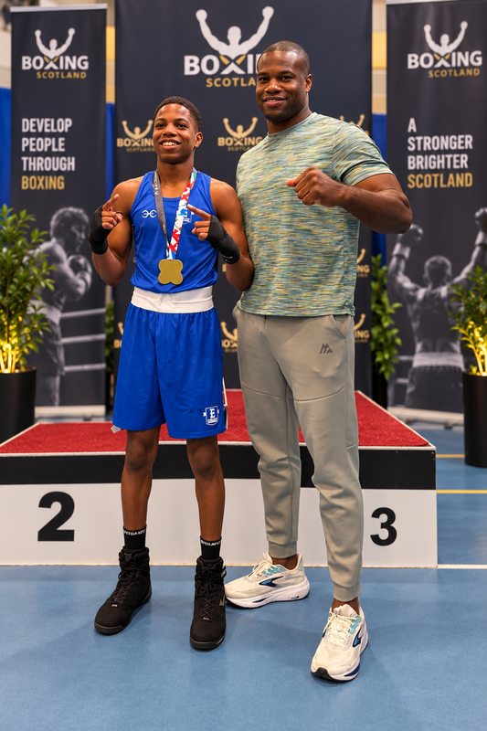 daniel dubois and solomon dubois with their southpaw black boxing socks at 4 nations boxing chanmpionships