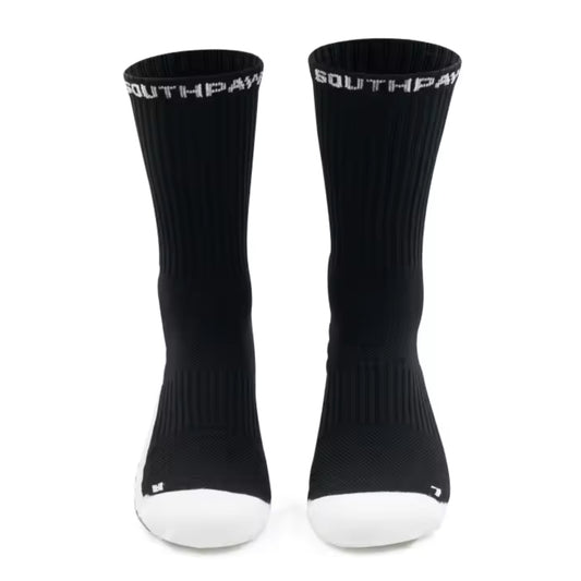 Black socks with white sole and 'Southpaw' branding on a white background