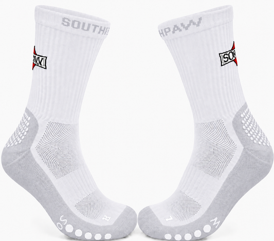 A pair of white and grey athletic crew socks with grip dots on the soles, featuring the Southern Paw logo and 'SOUTHPAW' text on the cuffs, set against a plain white background.