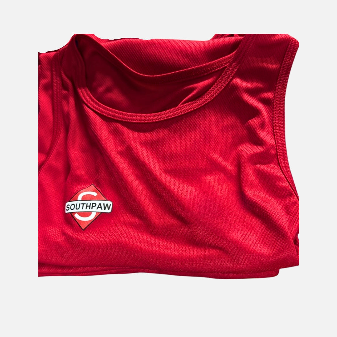 Folded Southpaw red boxing vest showing logo and competition design details.